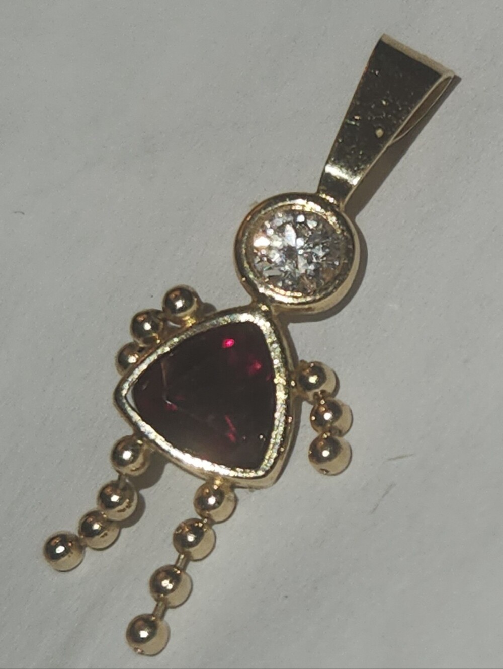 Gold Pendant Necklace with Deep Red Triangle Gem and Clear Accent